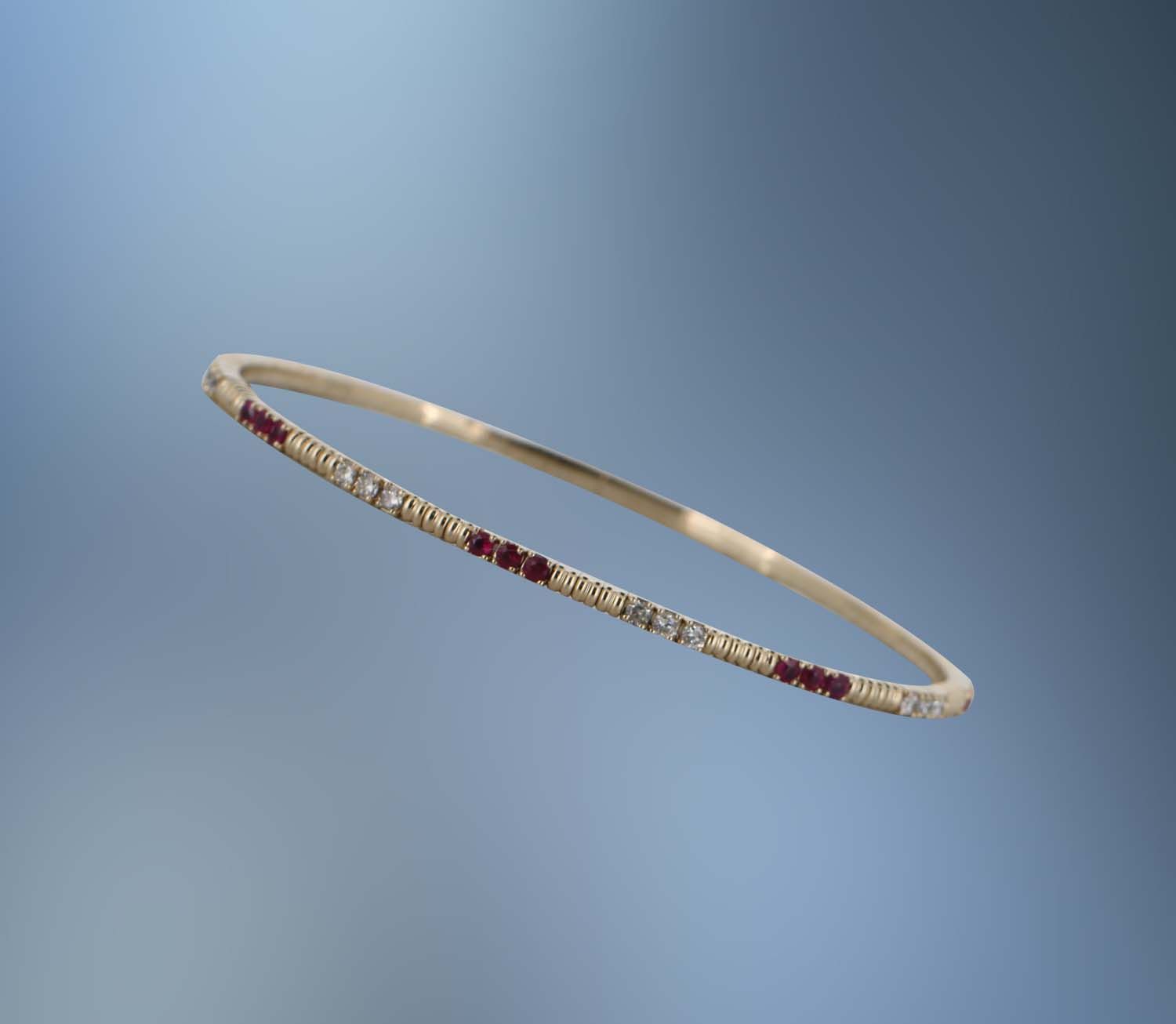 14KT YELLOW GOLD FLEXIBLE DIAMOND AND RUBY BRACELET