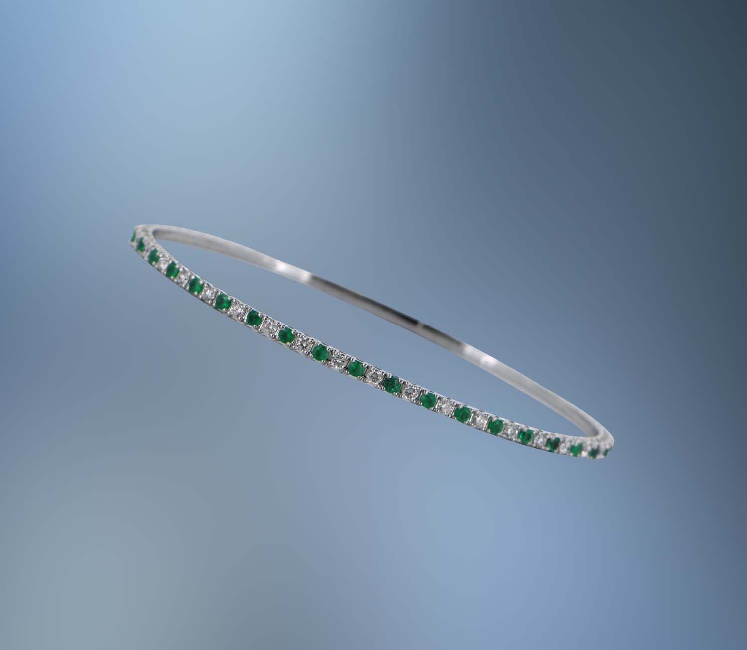 14KT WHITE GOLD FLEXIBLE DIAMOND AND EMERALD BRACELET