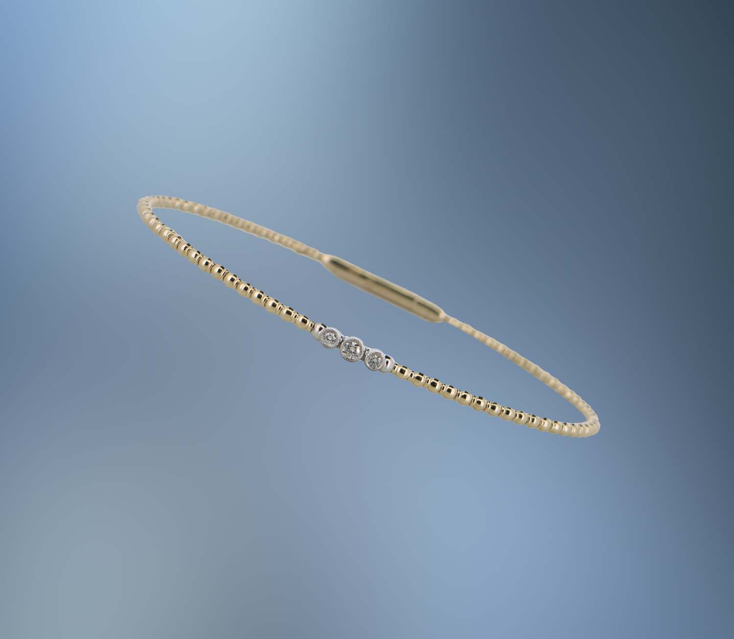 ONE 14KT YELLOW GOLD DIAMOND FLEXIBLE BANGLE