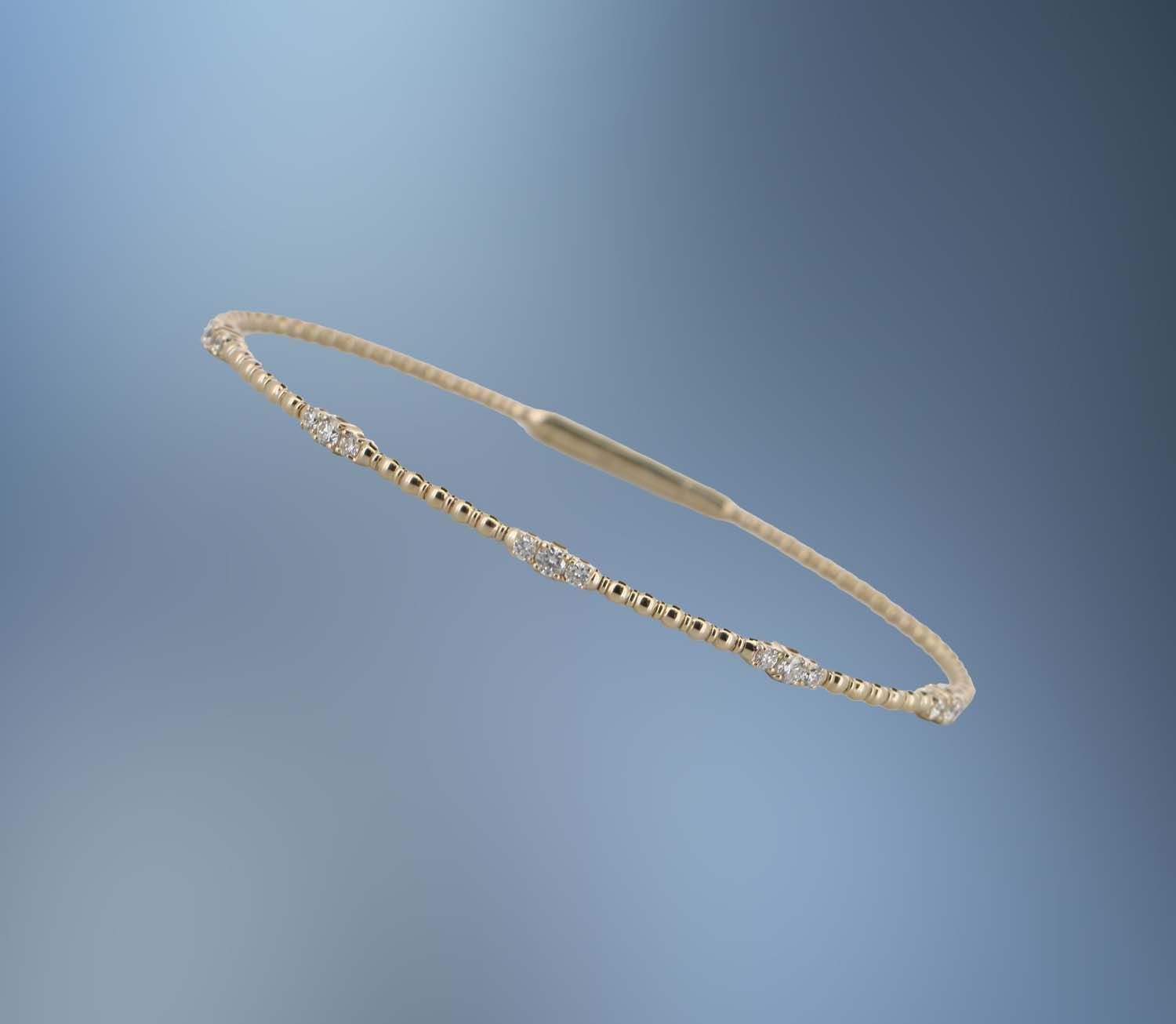 ONE 14KT YELLOW GOLD DIAMOND FLEXIBLE BANGLE