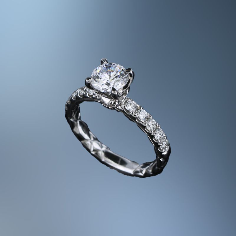 A. JAFFE 14KT WHITE GOLD ENGAGEMENT RING FEATURING 12 ROUND BRILLIANT CUT DIAMONDS TOTALING 0.46 CTS A. JAFFE 14KT WHITE GOLD ENGAGEMENT RING FEATURING 12 ROUND BRILLIANT CUT DIAMONDS TOTALING 0.46 CTS