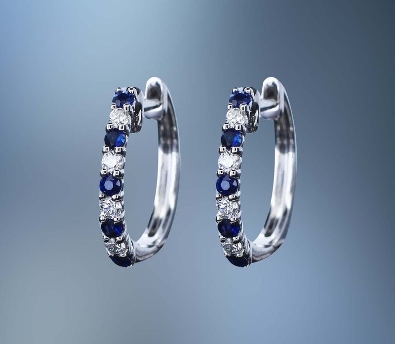 14KT WHITE GOLD SAPPHIRE AND DIAMOND EARRINGS FEATURING 5 SAPPHIRES TOTALING .18 CTS AND 4 DIAMONDS TOTALING .10 CTS