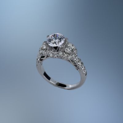 ONE 14KT WHITE GOLD DIAMOND ENGAGEMENT RING FEATURING 36  ROUND BRILLIANT CUT DIAMONDS TOTALING 1.43 CTS.