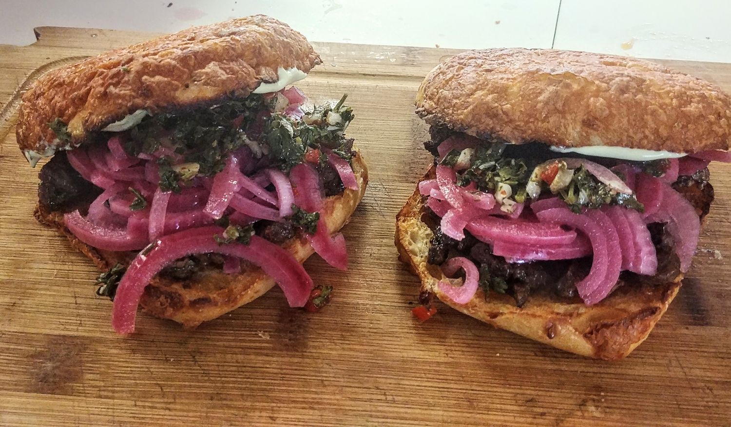 Carlitos's Steak Sandwich - Steak Pickled Onions, Chimichurri Salsa & Mayo Carlitos's Steak Sandwich - Steak Pickled Onions, Chimichurri Salsa & Mayo