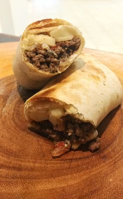 The Wrap of Pleasure by Deniz - Beef, Caramelized Onions, Salsa, Cheese, Mayo. The Wrap of Pleasure by Deniz - Beef, Caramelized Onions, Salsa, Cheese, Mayo.