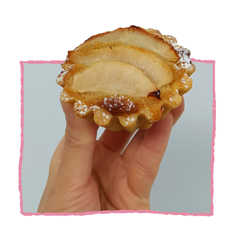 amandine tart with a caramel coloured frangipane filling with sliced pears on top