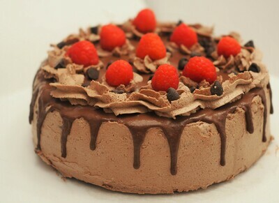 Vegan chocolate- raspberry cake with chocolate ganache and cream-cheese frosting