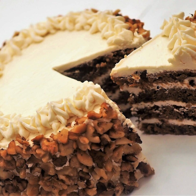 Vegan carrot cake with cream cheese frosting and roasted walnuts. GLUTEN FREE available.