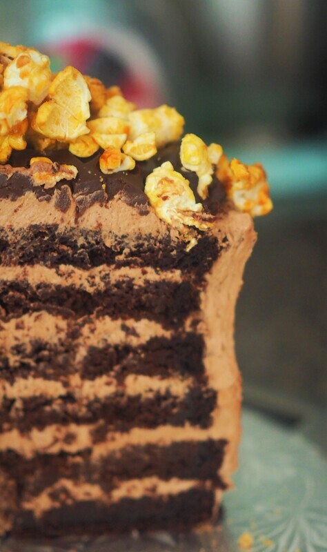 Vegan chocolate cake with chocolate swiss meringue buttercream and vegan caramel popcorn on the top. GLUTEN FREE available.