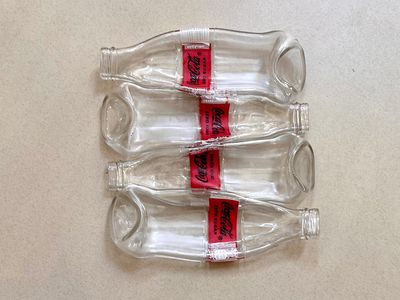 4 Coca Cola Bottles / ٤ زجاجات كوكاكولا