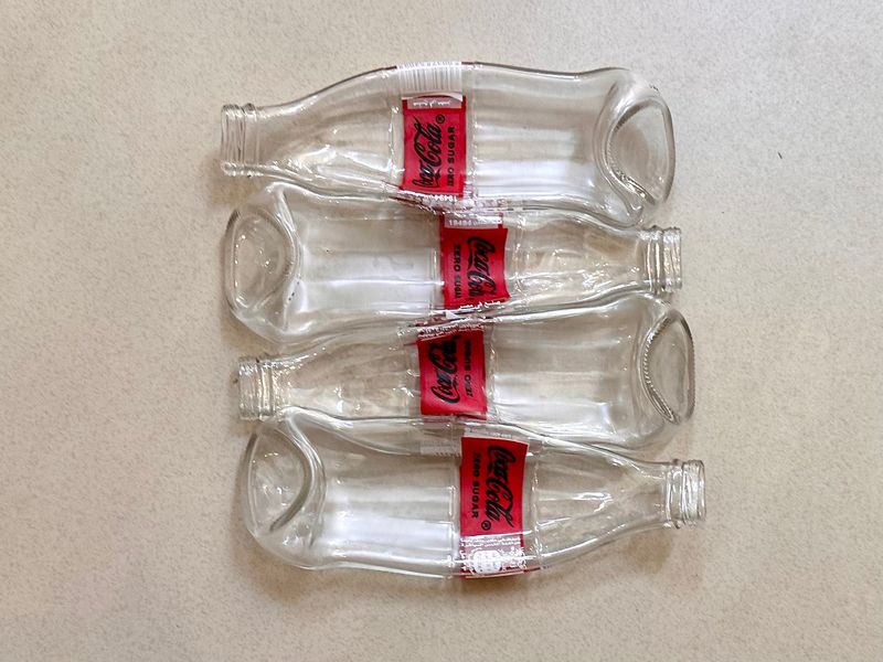 4 Coca Cola Bottles / ٤ زجاجات كوكاكولا