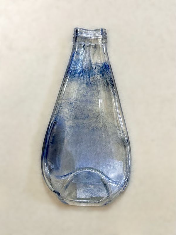 Small Blue Colored Bottle / زجاجة صغيرة زرقاء ملونة
