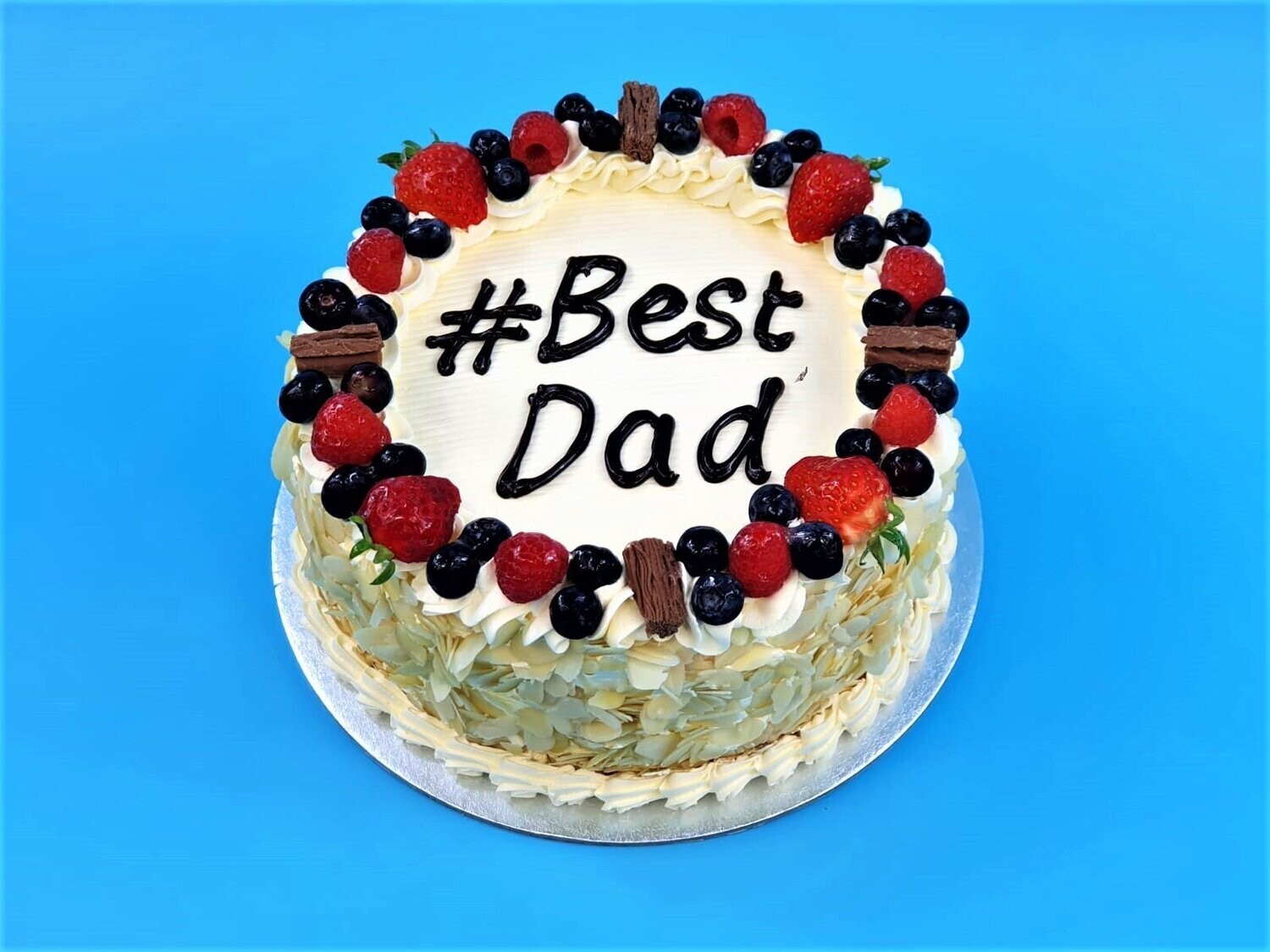 Mix Berries With Almond Nuts On Side Fathers day Cake