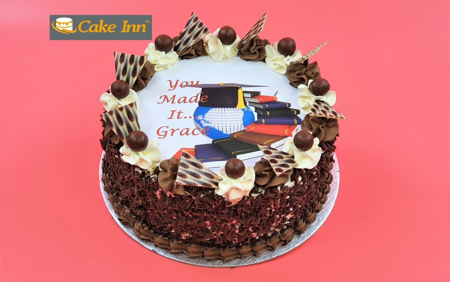 Maltesers On Top With Chocolate Curls On Side Graduation Cake