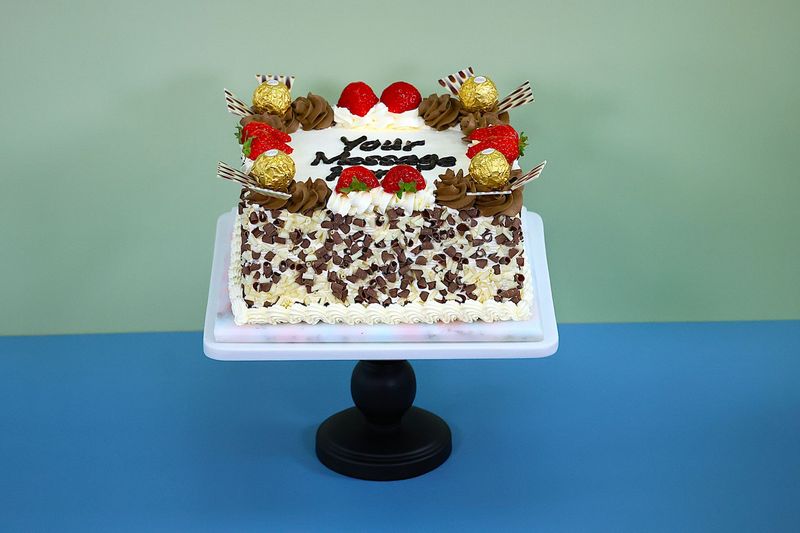 Ferrero & Strawberry Toppings With Chocolate Curls On Side Birthday Cake