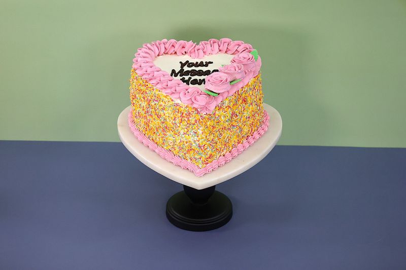 Pink Flowers & Sprinkles On Side Heart Celebration Cake