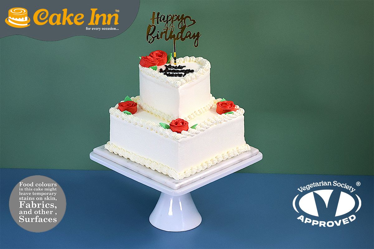 Flower With Heart On Top Tier Cake