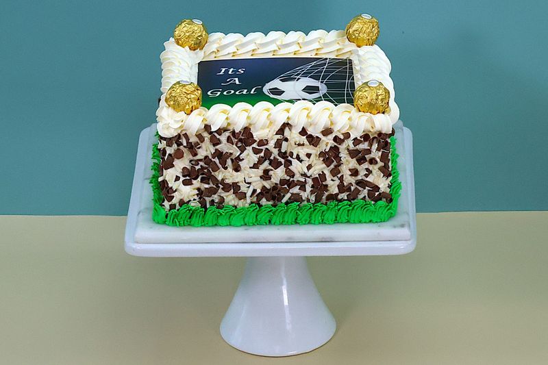 Ferrero With Chocolate curls on side Football Theme Cake Ferrero With Chocolate curls on side Football Theme Cake
