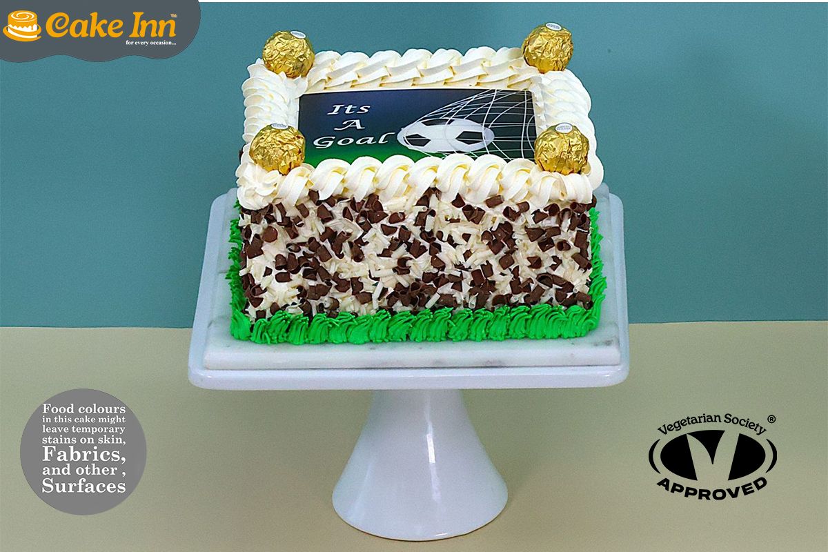 Ferrero With Chocolate curls on side Football Theme Cake Ferrero With Chocolate curls on side Football Theme Cake