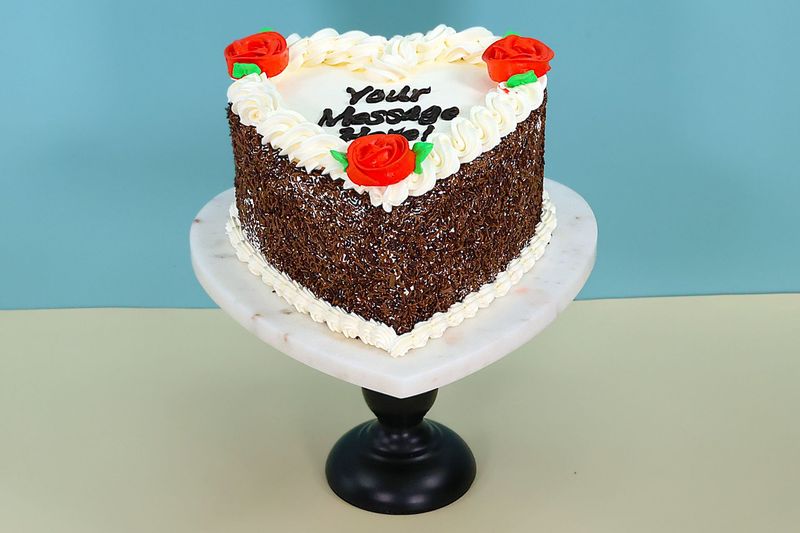 Red Flowers With chocolate sprinkle's On Side Heart Celebration Cake