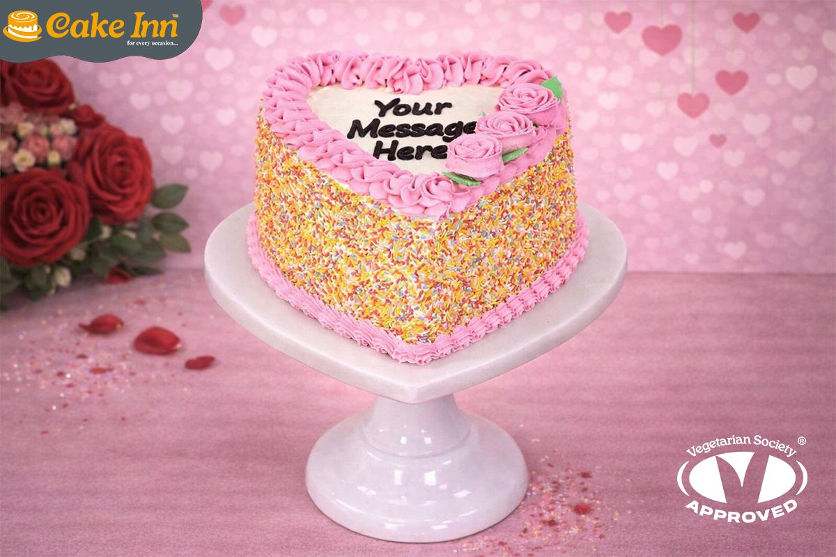 Pink Flowers & Sprinkles On Side Heart Celebration Cake