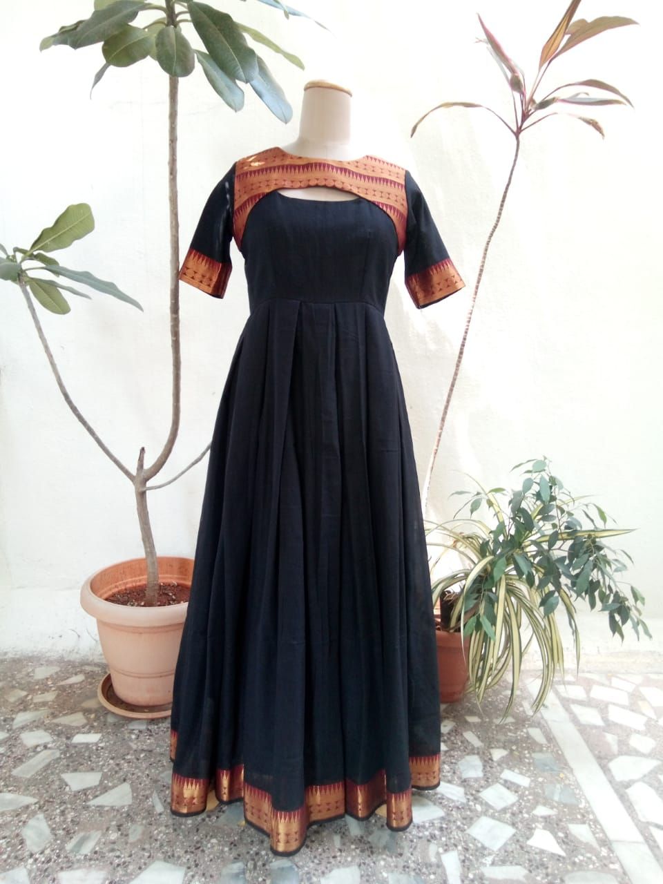 Black and brown silk crafted with border pattern.