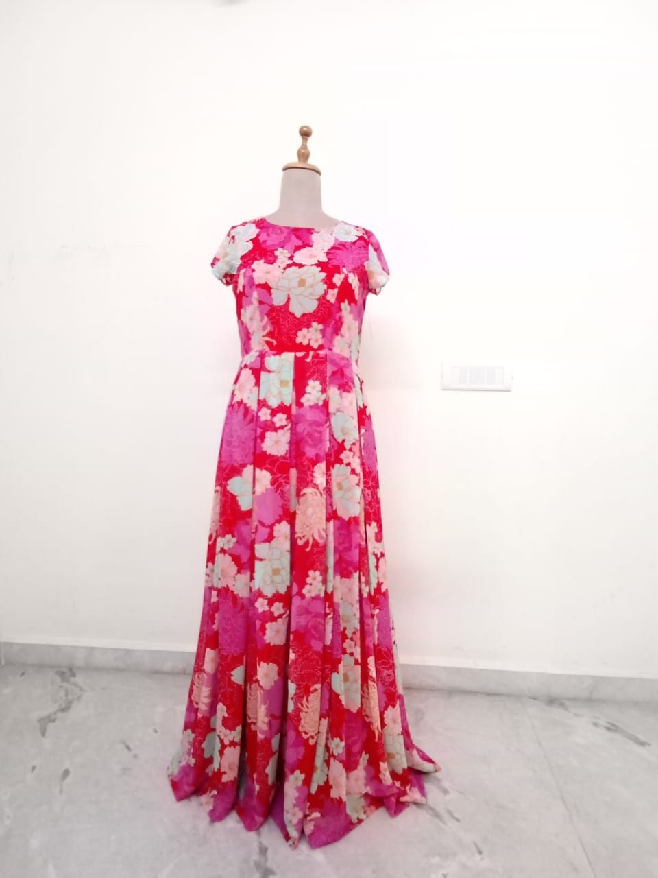 Red Georgette pleated flared Gown.
