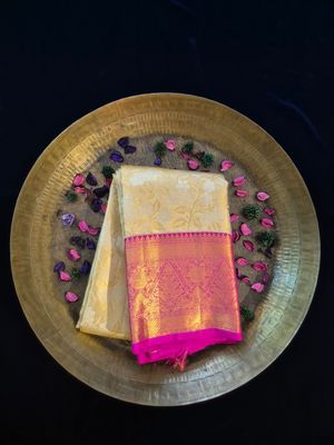 Luxurious Golden Brocade Saree with Maroon Border.