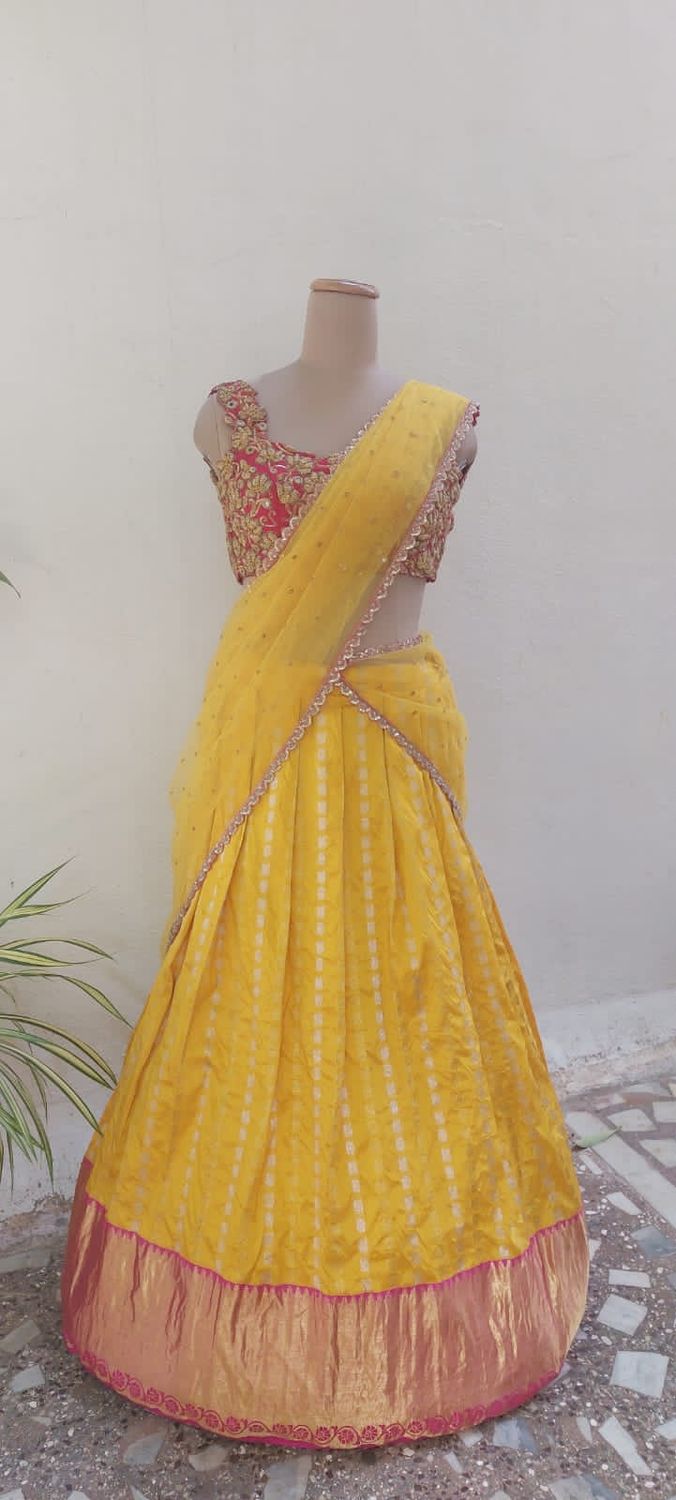 Bright Yellow Embroidered Lehenga with Contrasting Blouse.