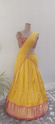 Bright Yellow Embroidered Lehenga with Contrasting Blouse.