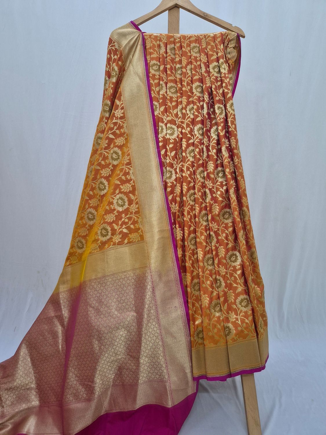 Elegant Maroon and Gold Embroidered Silk Saree with Traditional Floral Patterns.