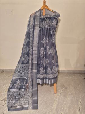 Elegant Blue and White Handwoven Silk Saree with Intricate Motifs.