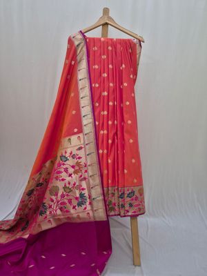  Elegant Peach and Magenta Banarasi Silk Saree with Intricate Floral Border.