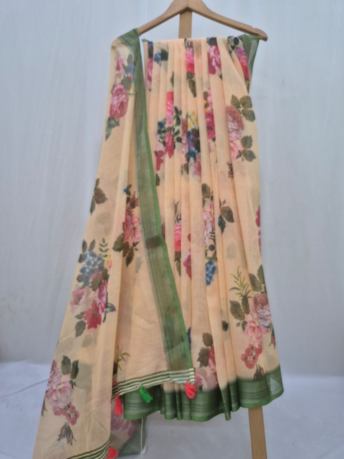  Pastel Floral Saree with Green Border and Tassel Detailing.