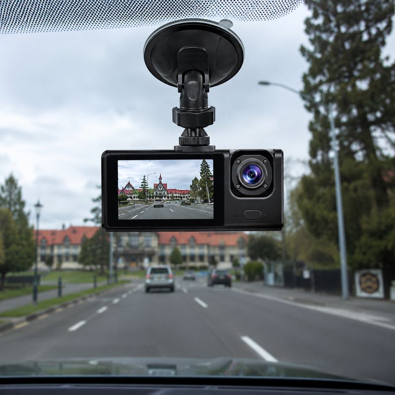 WiFi 3 camera dash cam mounted on a car windscreen, showing front road view on the display with front, cabin and rear camera