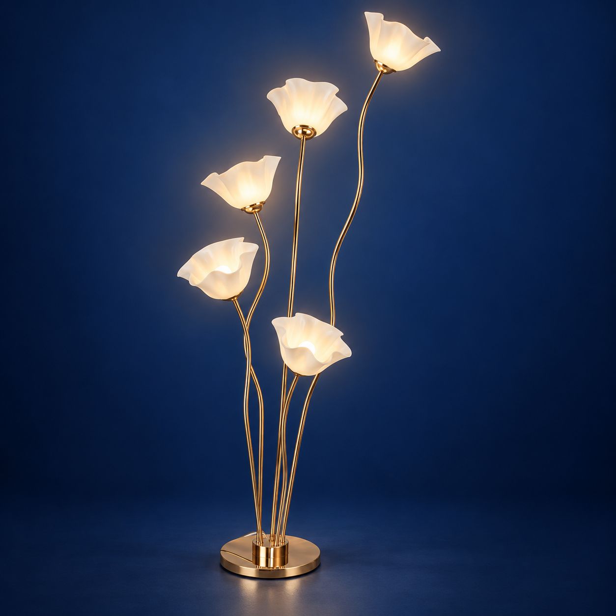 Five-flower LED floor lamp with warm white lights, curved gold stems and round base against a deep navy blue background.
