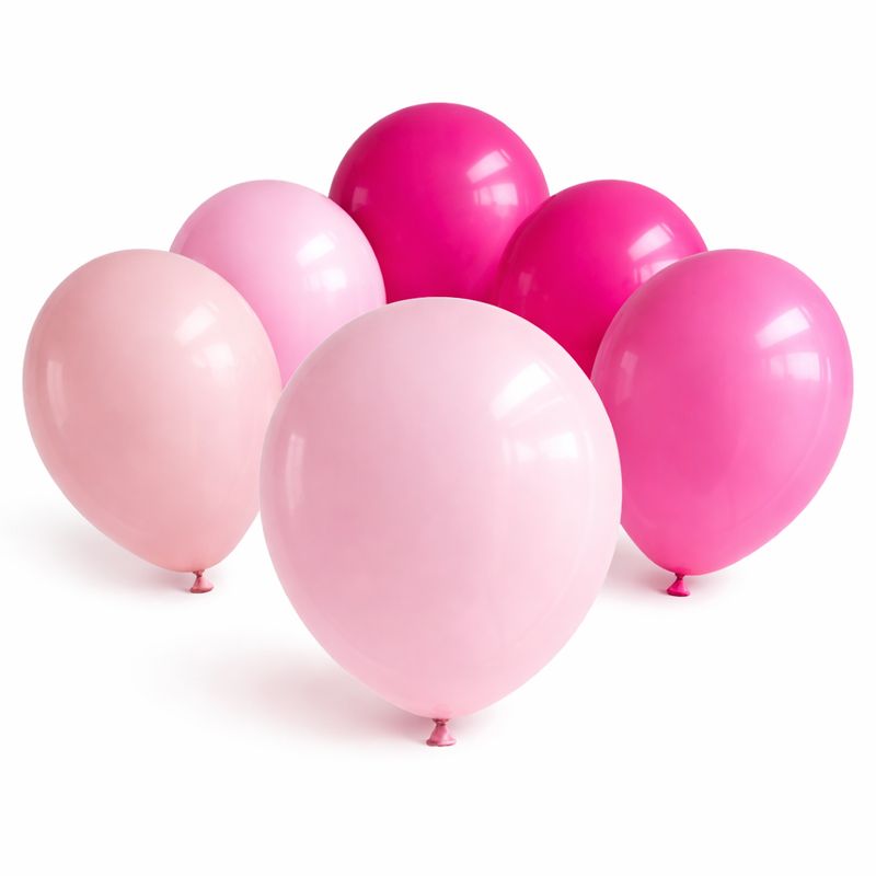 Pink balloons assortment in light and dark shades arranged together on white background for party decoration use
