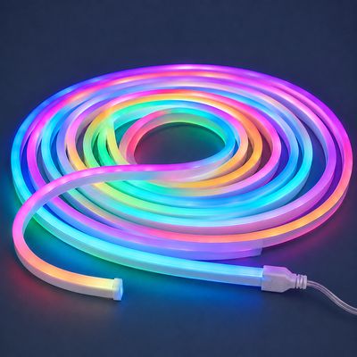 10m RGB flexi neon strip light loosely coiled and glowing in vibrant pink, blue, green, orange and purple colours.