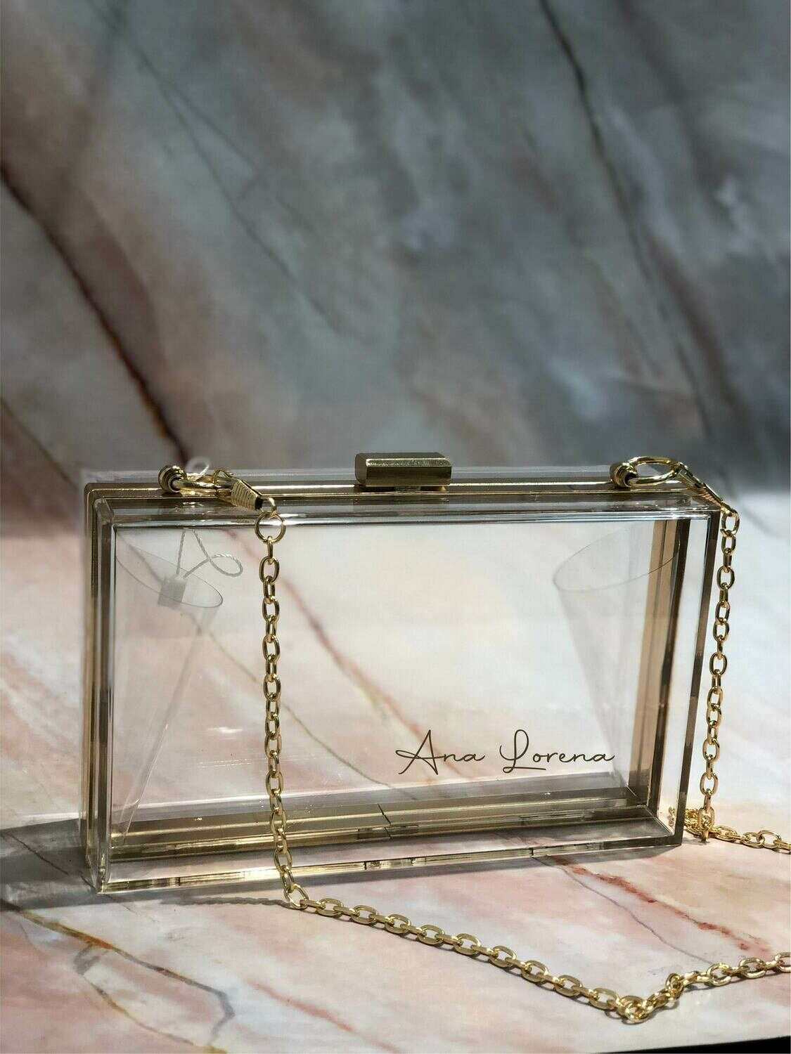 Cartera Acrílica Transparente con Dorado
