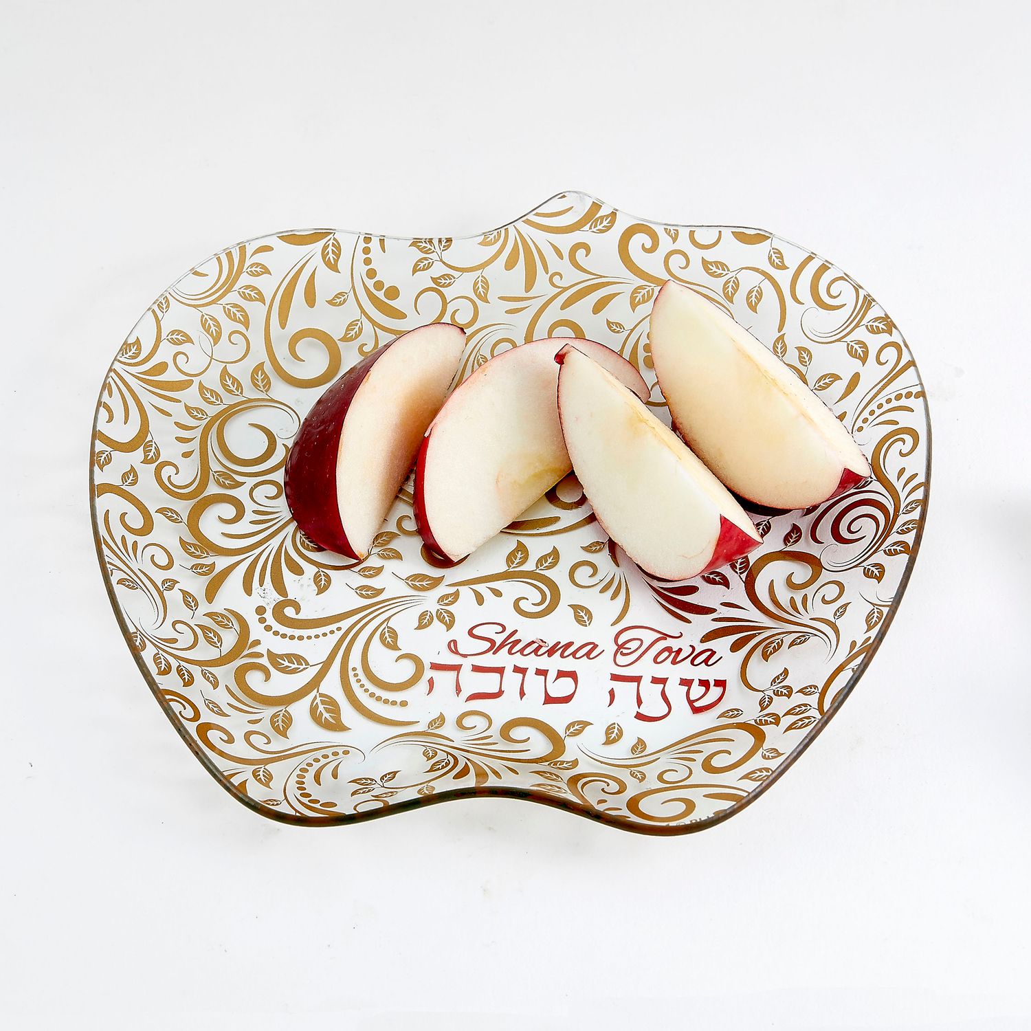 Plato en forma de manzana y detalles dorados