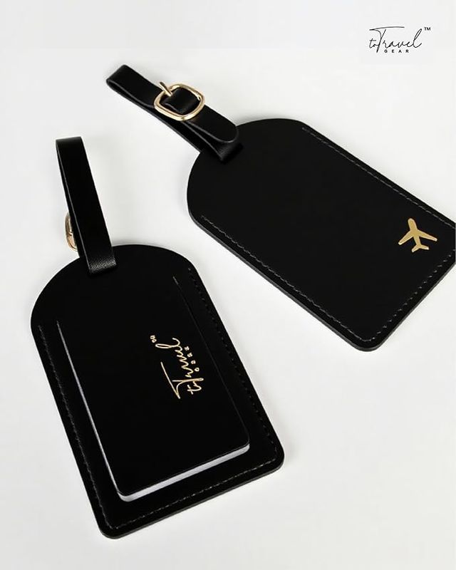 Tag de maleta negro con detalle dorado