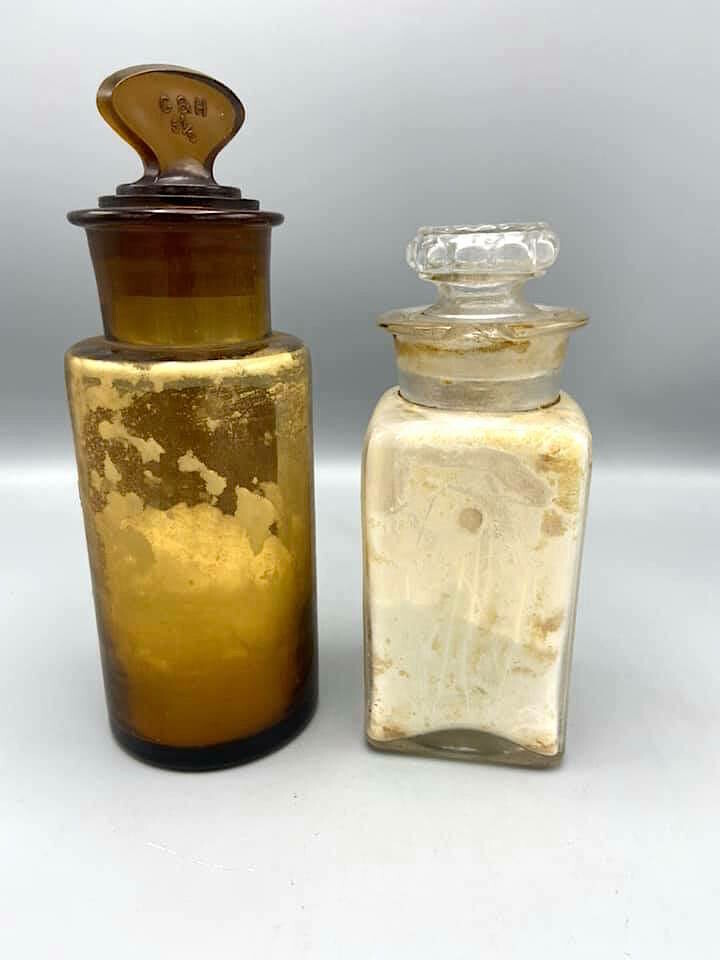 Set of two old authentic pharmacy bottles