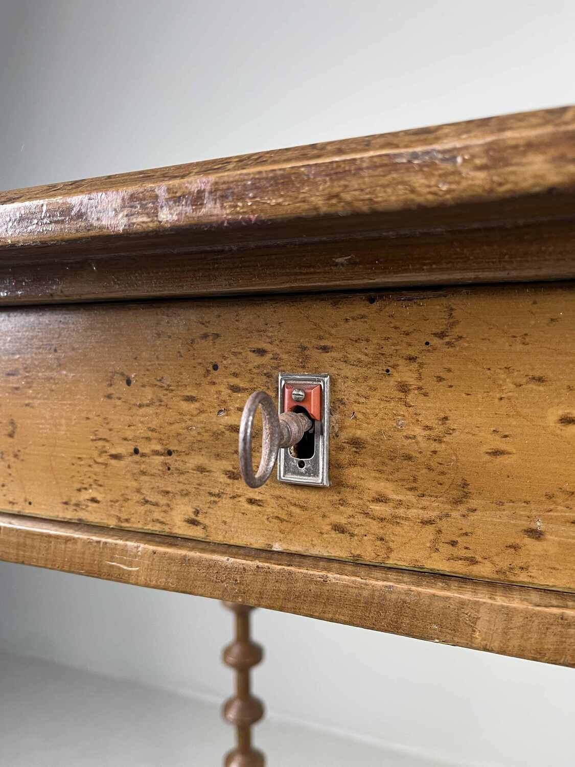 Elegant antique side table with drawer.