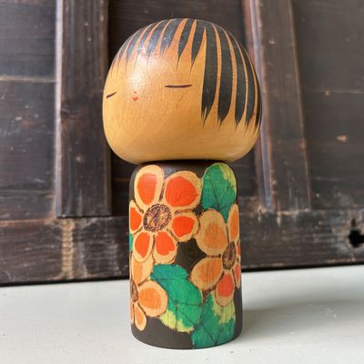 Collectible 1960s Kokeshi with Floral Motifs by Yuji Kawase