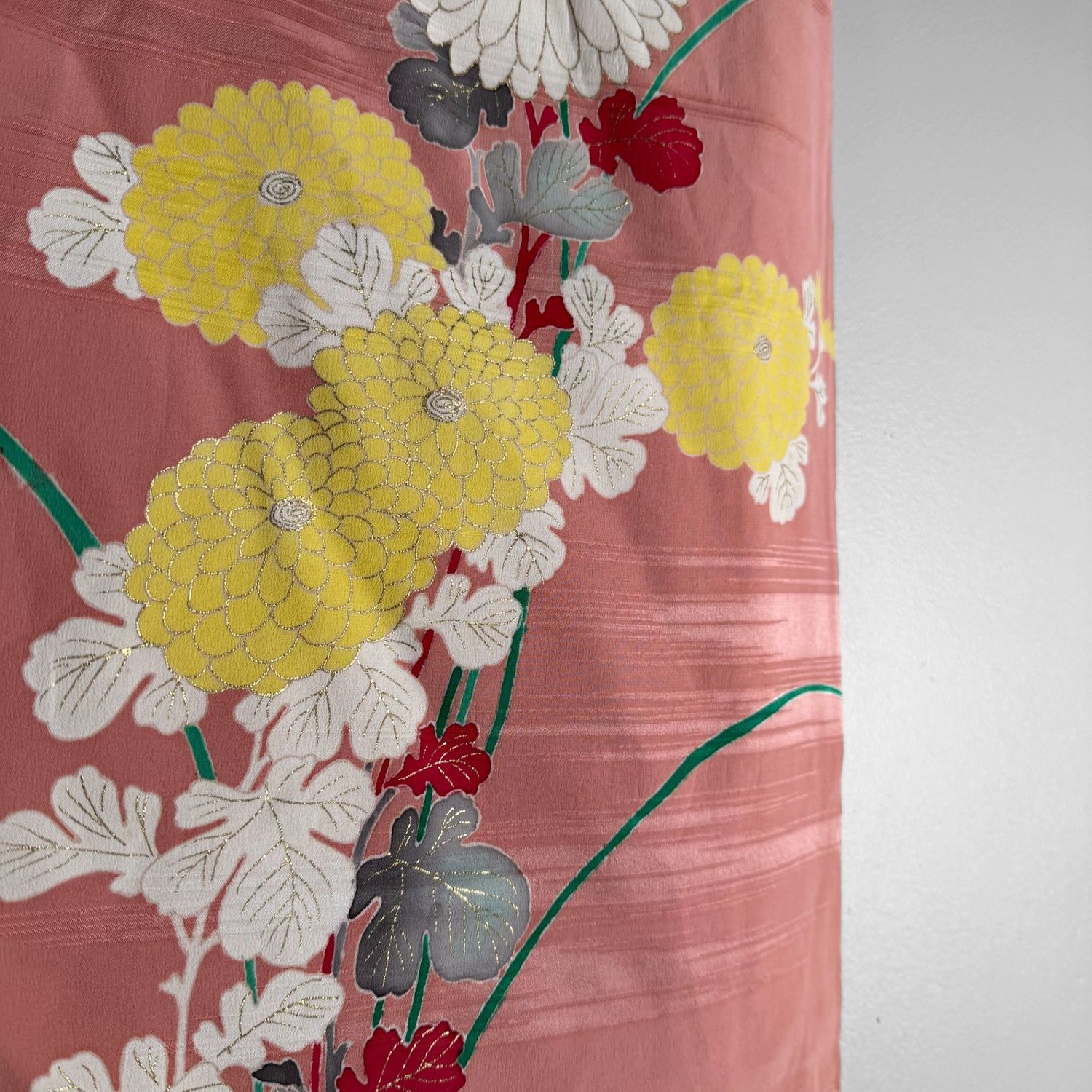 Salmon-pink Japanese silk kimono with chrysanthemums and embroidered accents, 1950s.