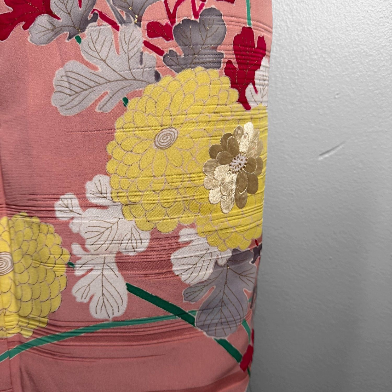 Salmon-pink Japanese silk kimono with chrysanthemums and embroidered accents, 1950s.