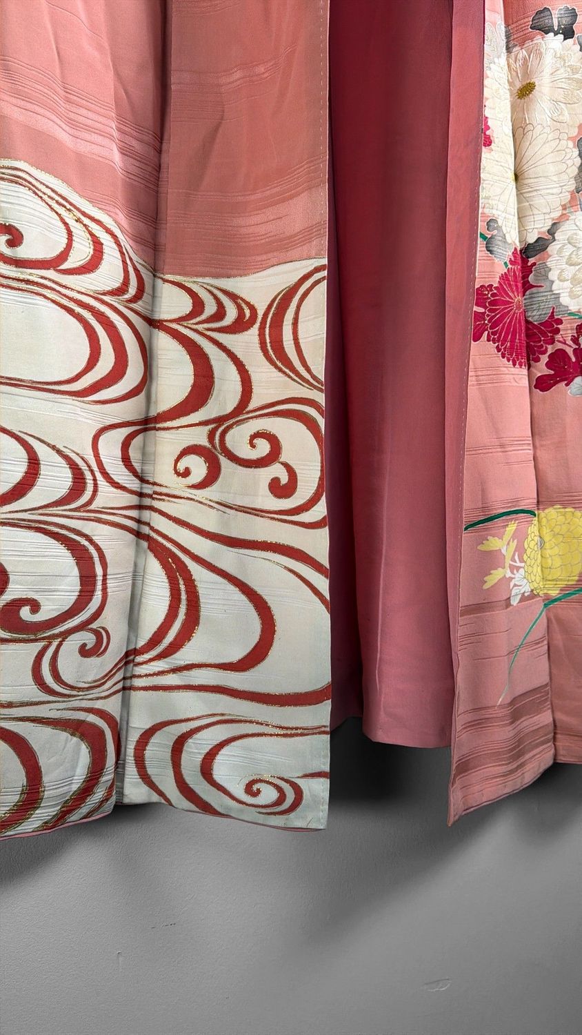 Salmon-pink Japanese silk kimono with chrysanthemums and embroidered accents, 1950s.