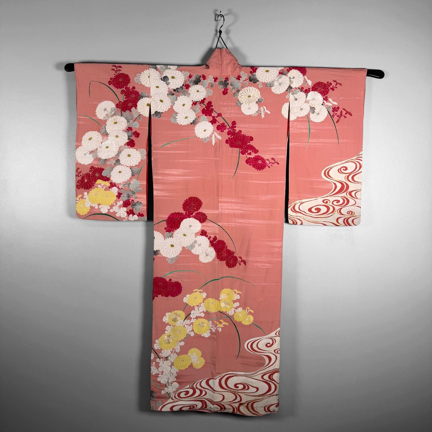 Salmon-pink Japanese silk kimono with chrysanthemums and embroidered accents, 1950s.