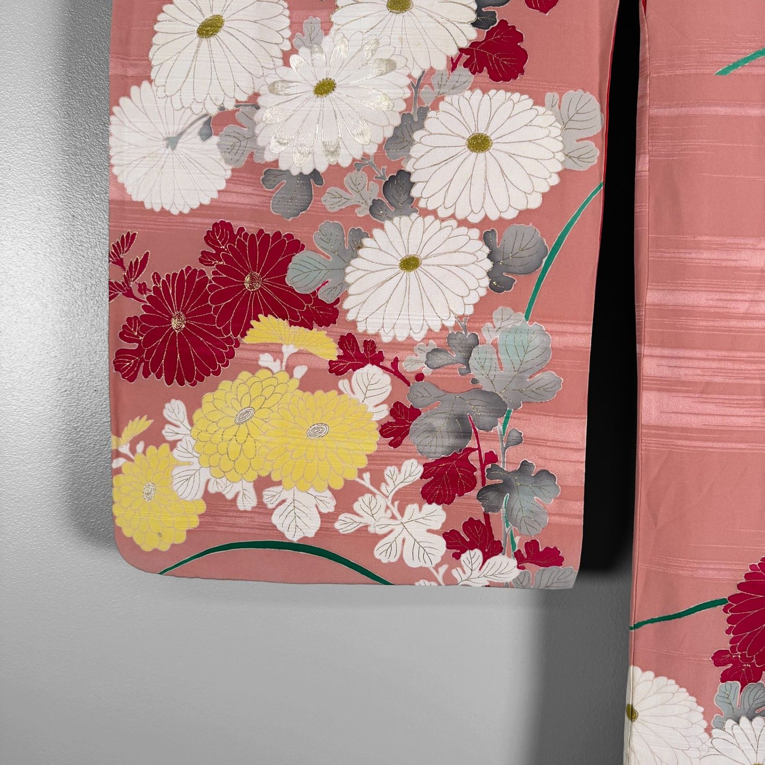 Salmon-pink Japanese silk kimono with chrysanthemums and embroidered accents, 1950s.