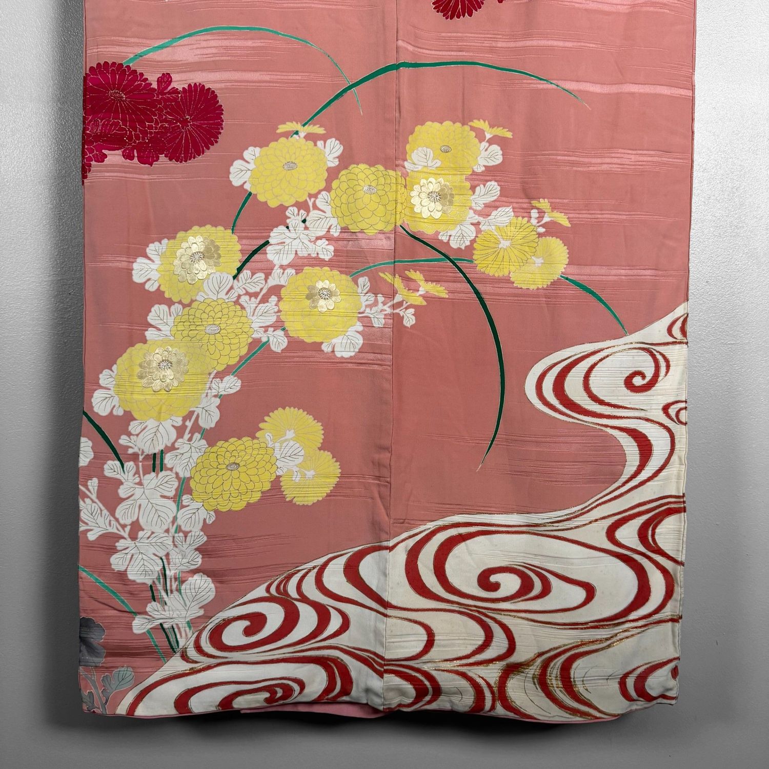 Salmon-pink Japanese silk kimono with chrysanthemums and embroidered accents, 1950s.